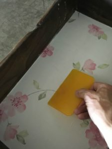 Update Your Furniture with Wallpaper - Smoothing out wallpaper