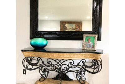 Before and after images of a repurposed wall-hanging mirror, transformed using eco-friendly paint and creative DIY techniques.