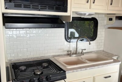 RV kitchen makeover using adhesive tile, backsplash transformation - a clean and easy DIY project.