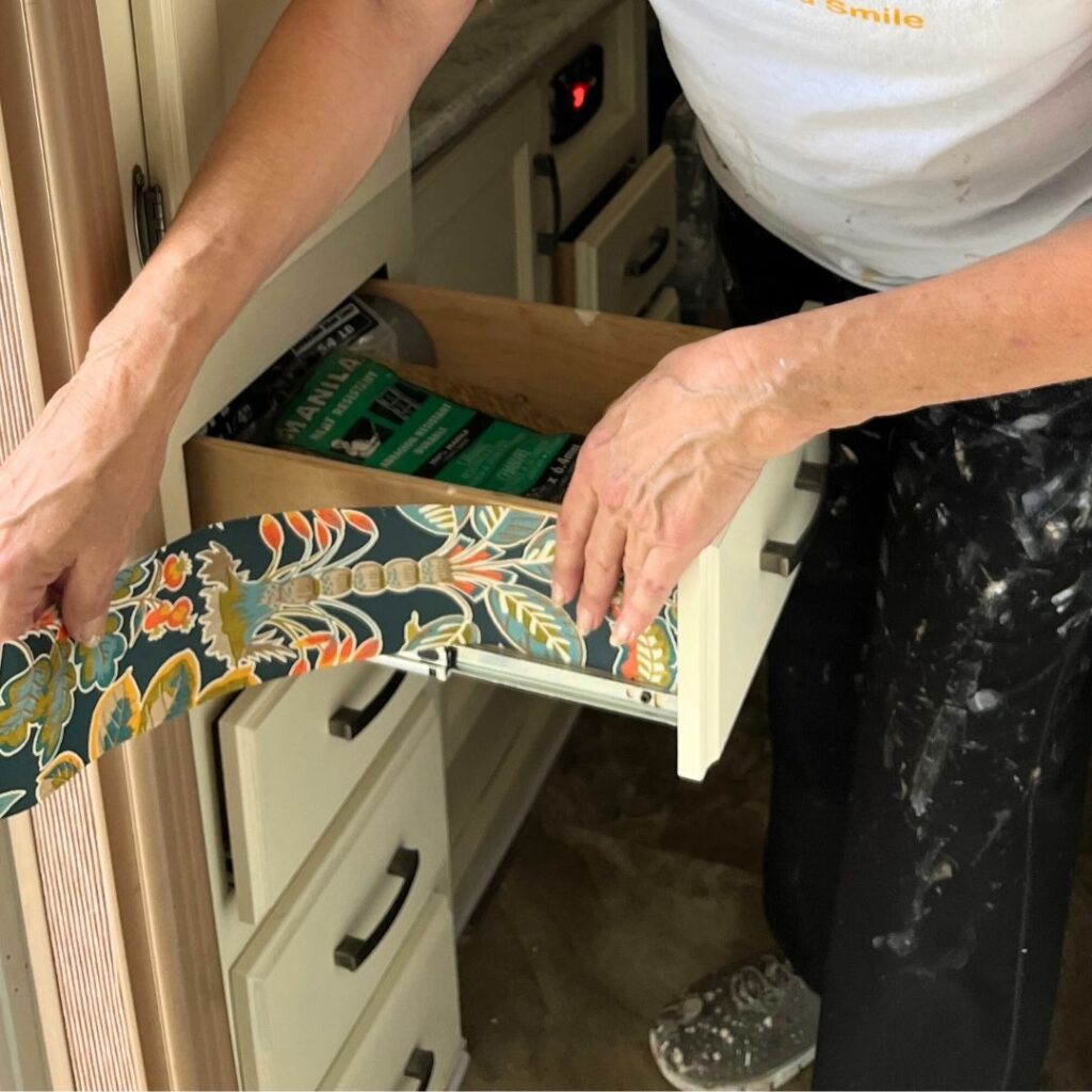 Drawer wallpaper transformation, a creative DIY home decor project.