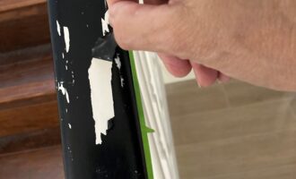 Image showing peeling latex paint over oil-based paint. Learn why it happens and how to fix it for a smooth, durable finish.